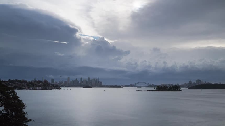 Landscape of a seaside city as day turns to night