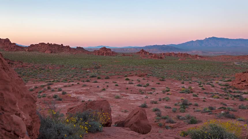 A time lapse of the sun setting over a desert