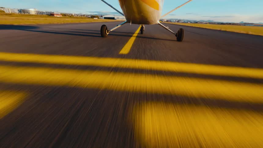 The plane is traveling on the runway
