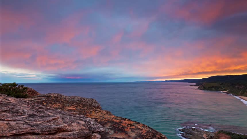 A time lapse of a sunset over a coast