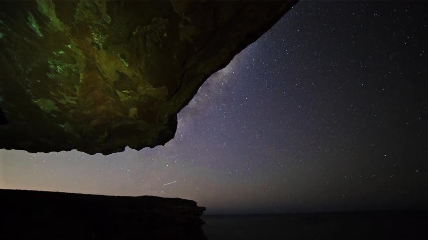 A time lapse of stars over a landscape