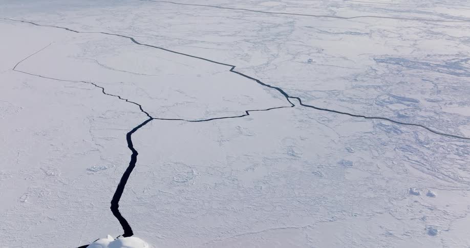 A frozen arctic lake on a winter day its wide surface covered in thick ice and snow