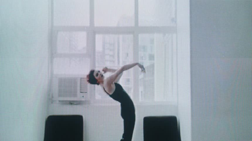 The woman leans back and swings her arms