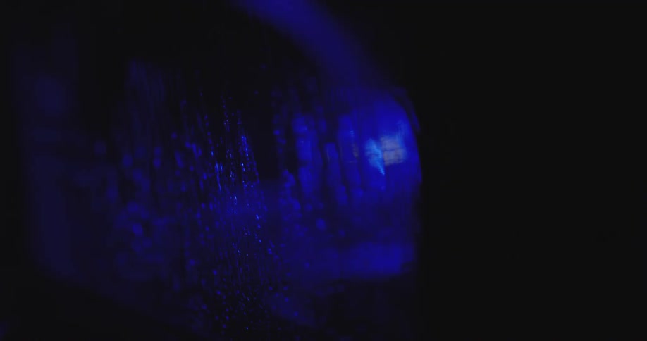Throughout the clip there are multiple thin vertical lines created by water running down a translucent surface