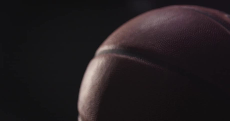 Basketball spinning indoors in a dark room