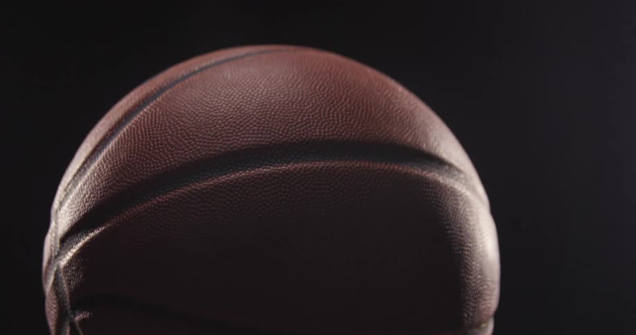 A close up of a basketball in a room