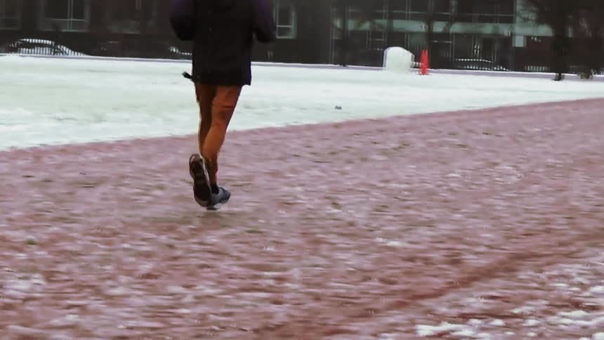 A person running outdoors in snow