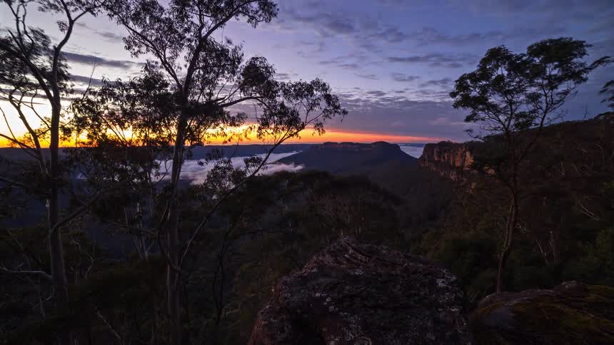 A time lapse of the sun rising over the coast