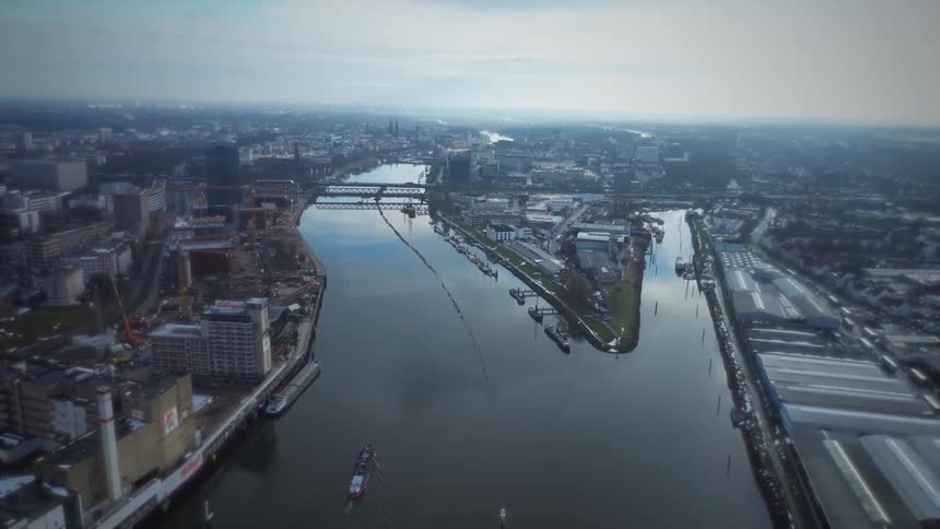 An aerial view of a large river in the middle of a city