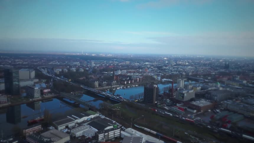 An aerial view of a large city with a river in the middle of it