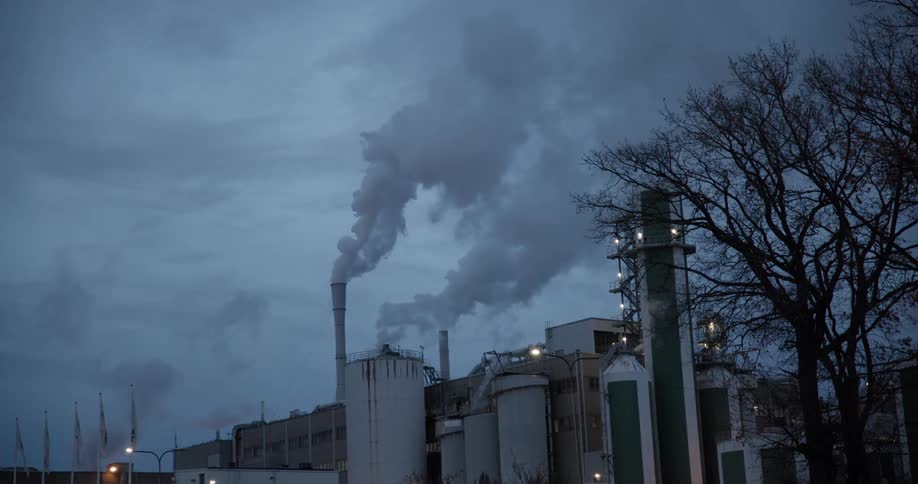 Factory releasing pollutants on a cloudy day