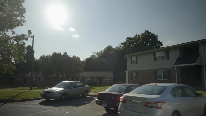 View of a parking lot outside of an apartment complex