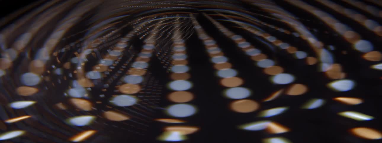 A close up of blue and gold dots on a screen