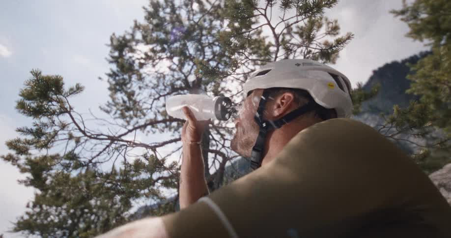 The man sprays water on his face