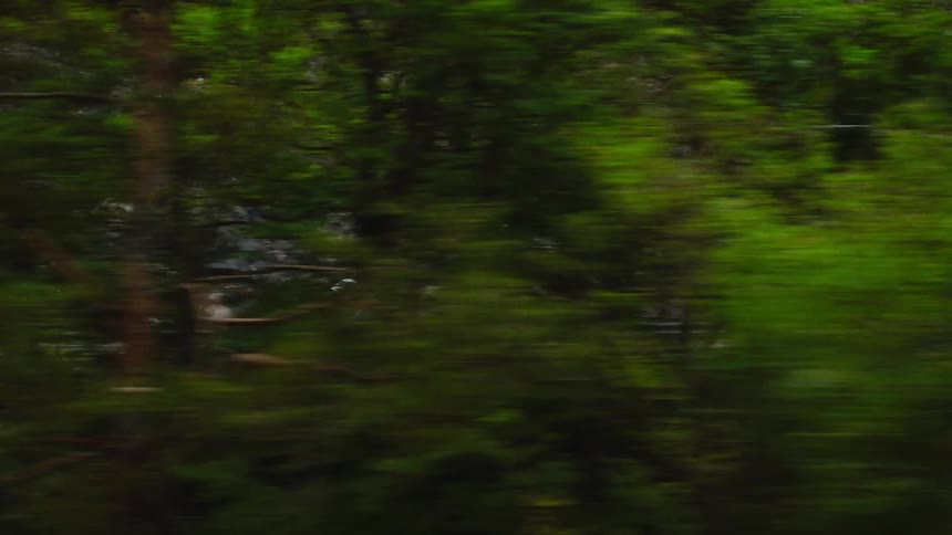 Man riding his bicycle on a mountainside road