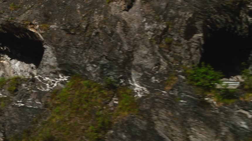 The cyclist rides on the trail through the cave