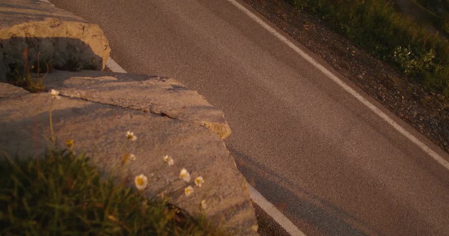 A person riding a bicycle up a road