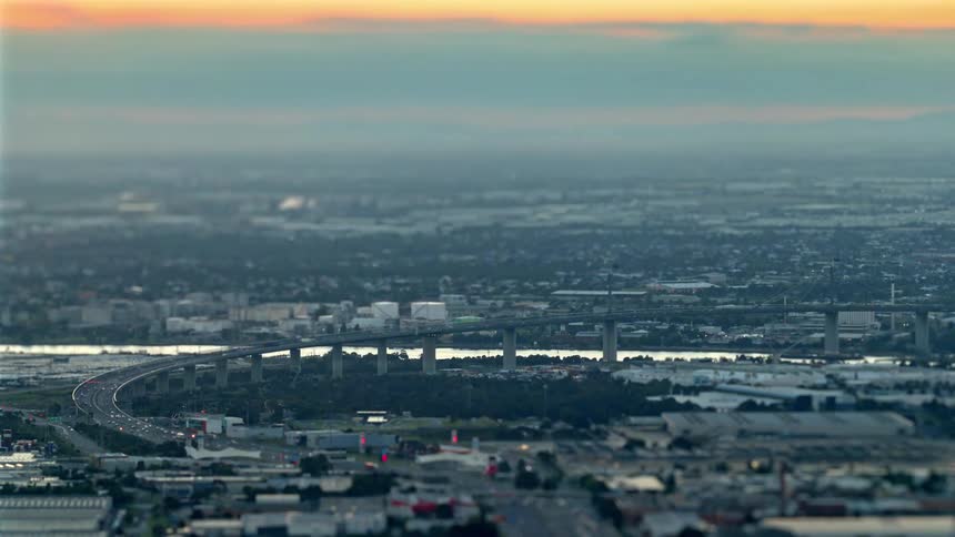 Heavy fog covers the city as the sun sets