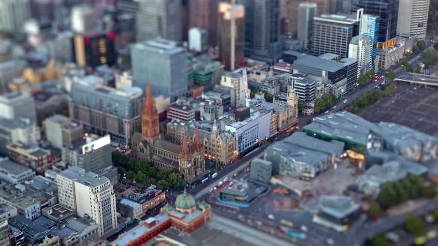 Aerial view of a metropolitan city block with a historic church among modern buildings