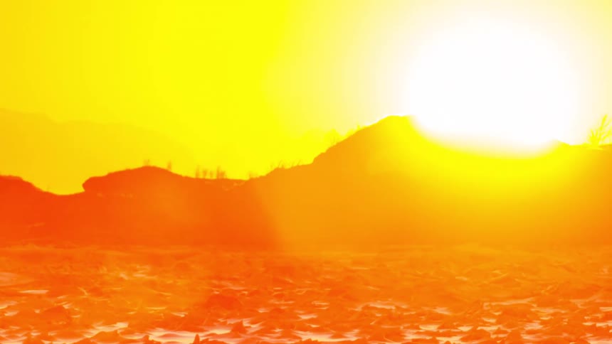 A landscape of hills with an orange atmosphere as the sun rises and sets