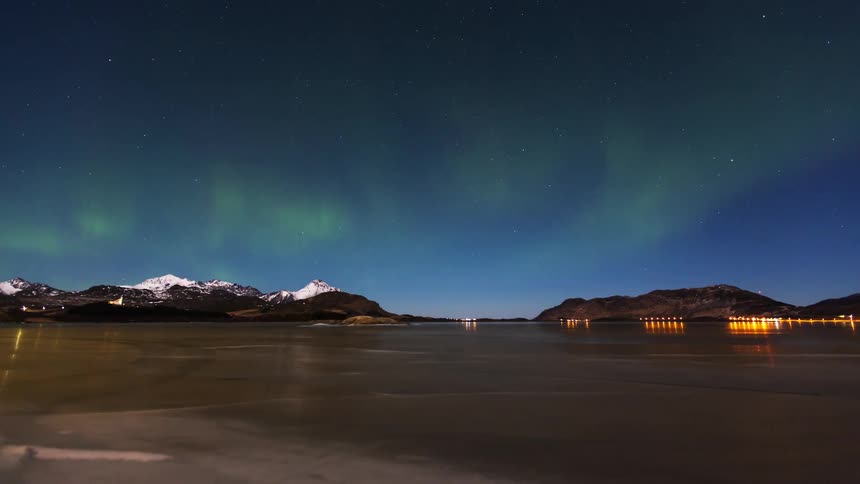 The green northern lights shine at night