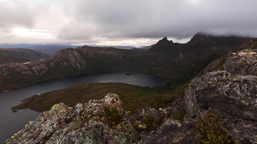 An aerial view of a mountain and lake