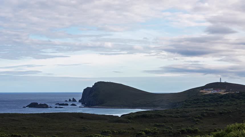 A long shot of a coastal cliffside