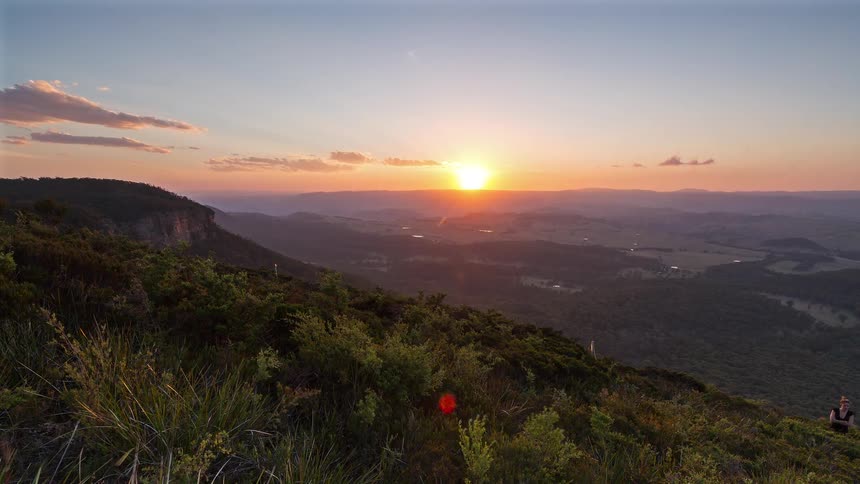 The photographer takes pictures of the setting sun