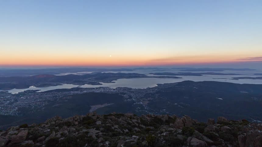 A time lapse of a landscape from day to night
