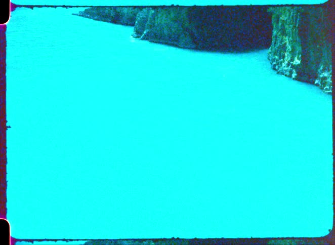A view of a coast with cliffs along it