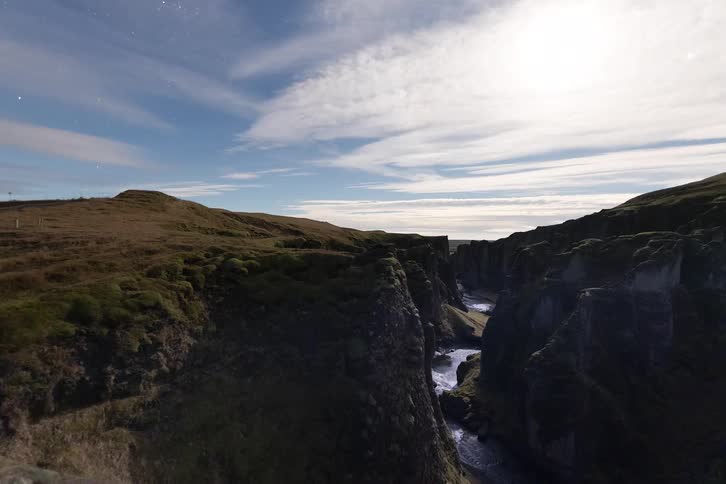 Rivers in a canyon with clouds above them