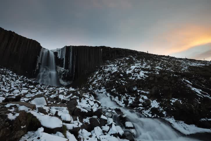 A river flowing off of a cliff