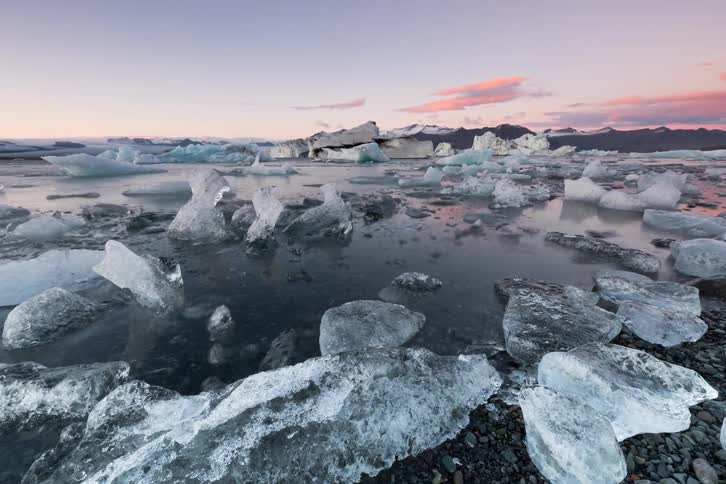 Some ice floating along land in the arctic