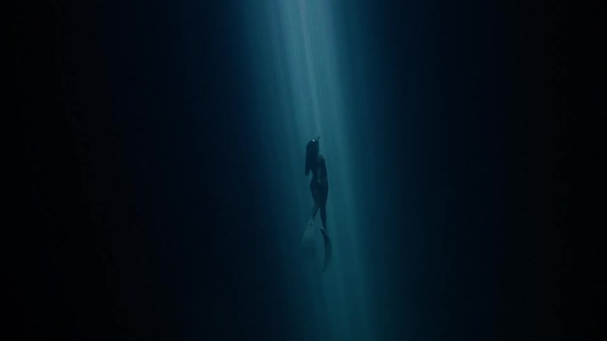 A person swimming underwater