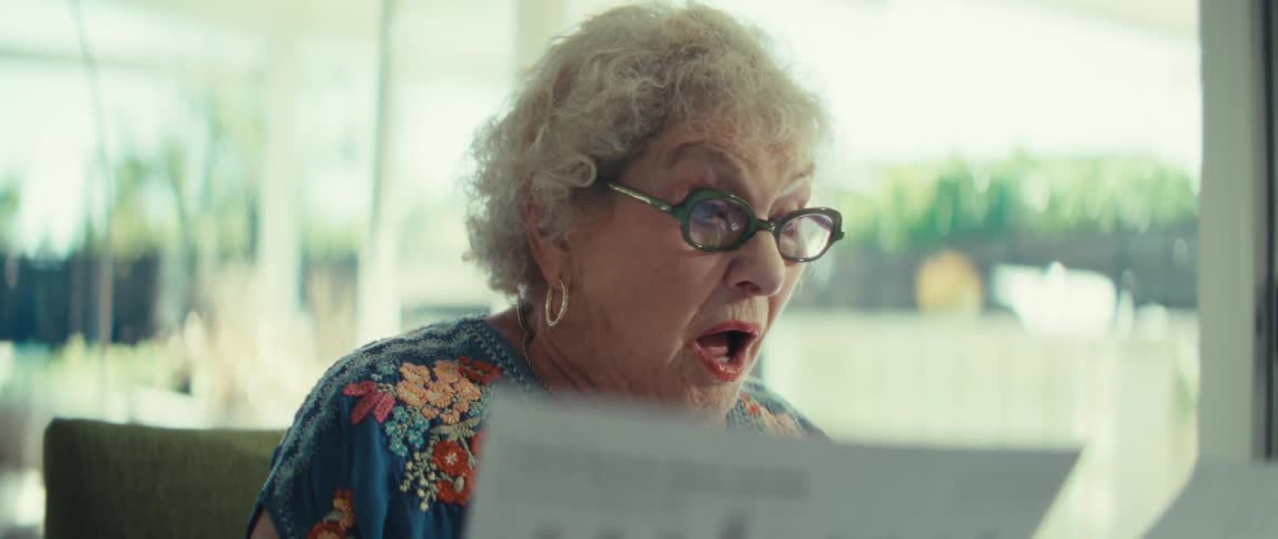 A woman reading papers in an office