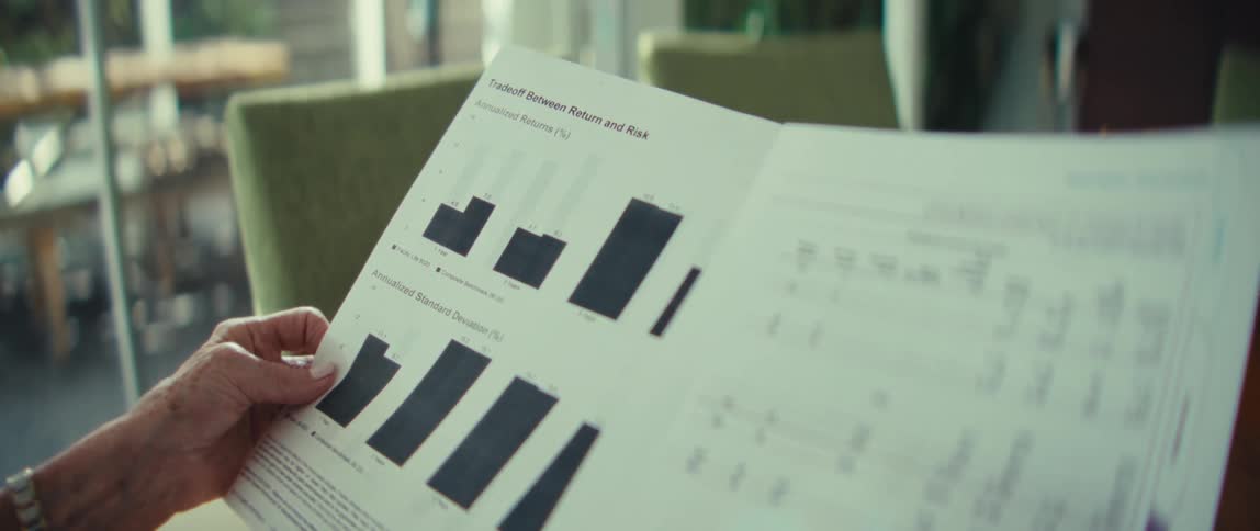 A woman looking at graphs on a paper