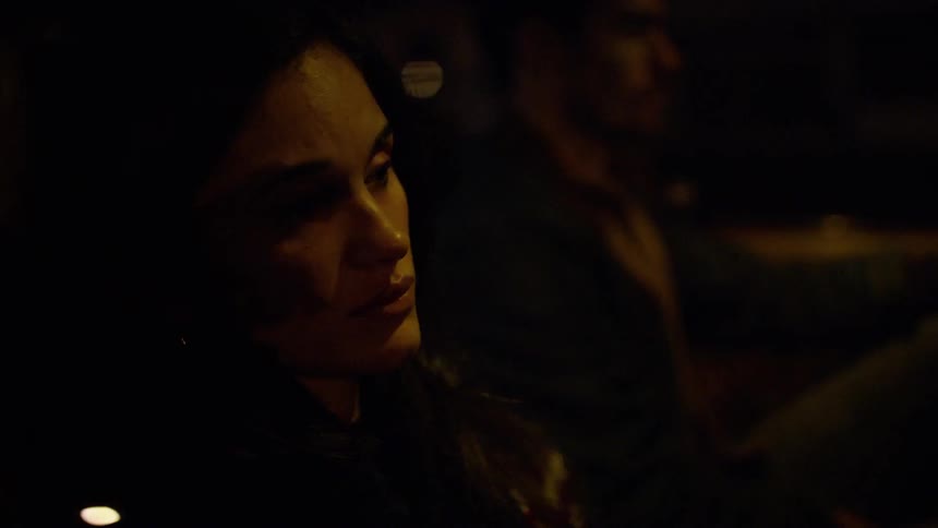 A sleeping woman opens her eyes in the passenger seat