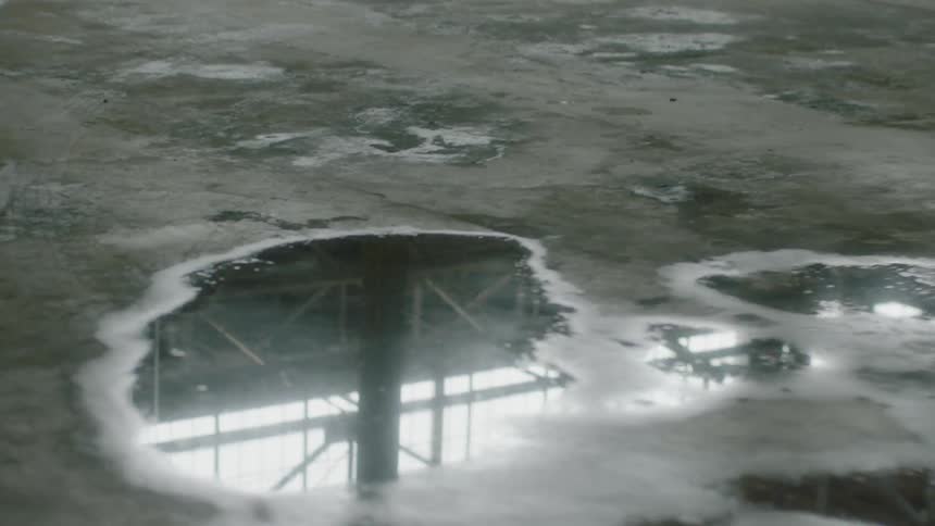 Water puddles pool on the concrete floor