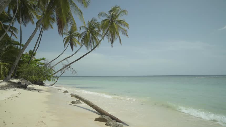 The tide flows onto the beach shore