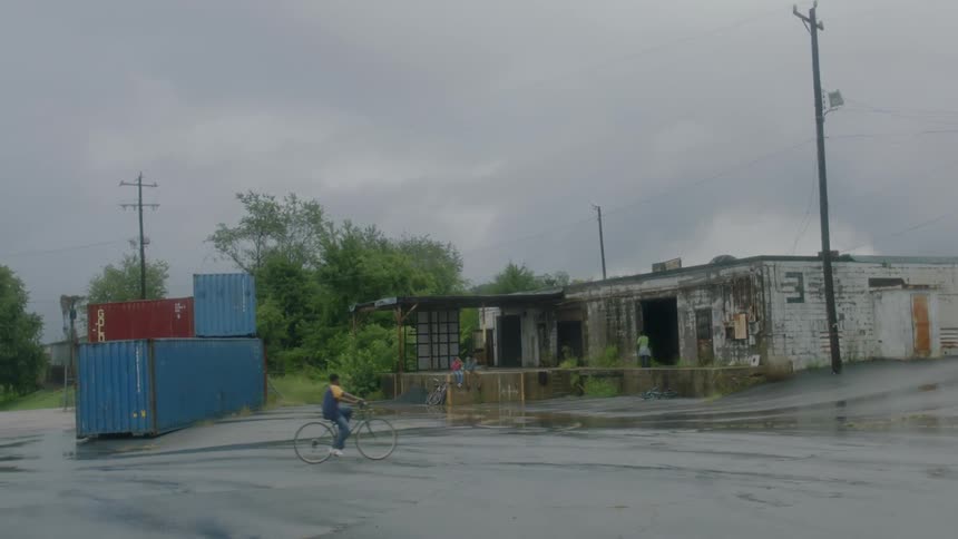 People ride their bikes on this empty street