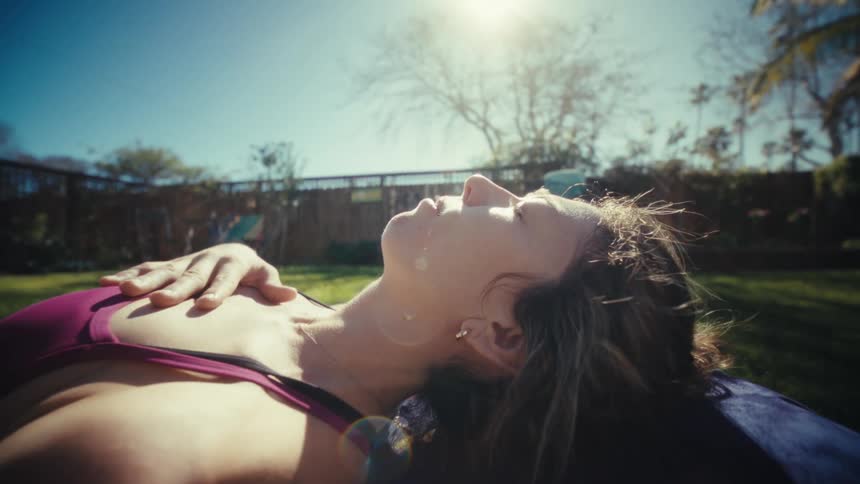 A woman doing some stretching outdoors