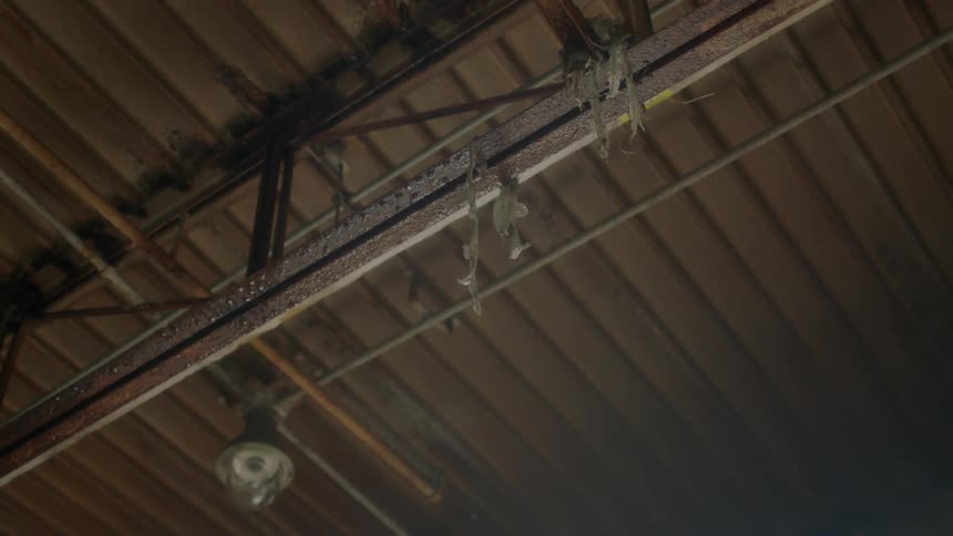 Water drips from a metal ceiling