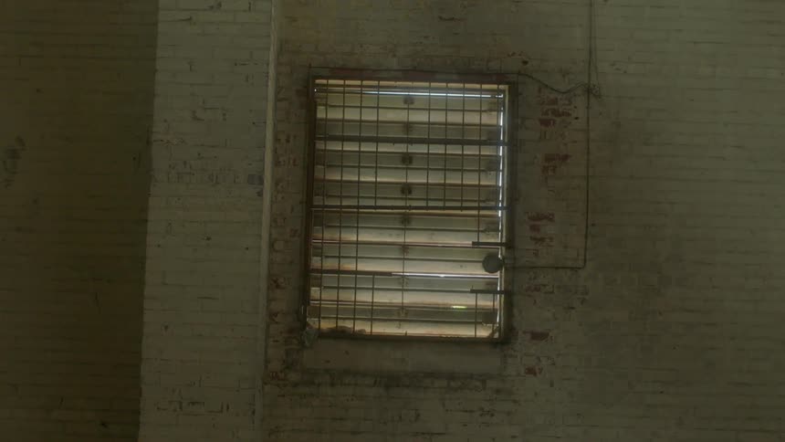 Fluorescent lights on a brick wall