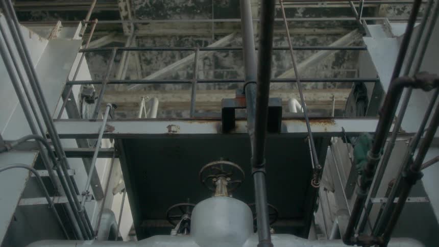 An industrial room lined with pipes