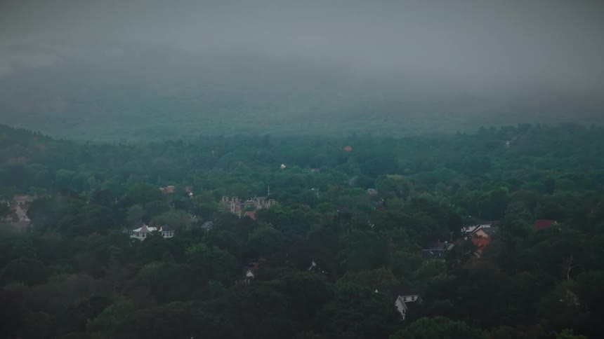 An aerial view of a community in a wooded area
