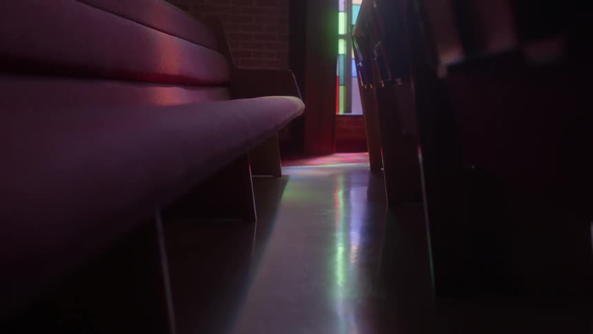 The pews in the church are empty