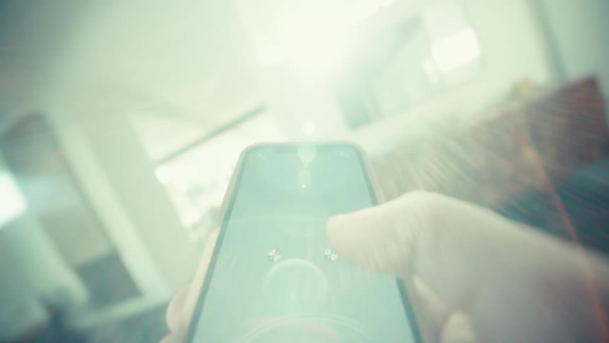 A person using a smartphone in a room