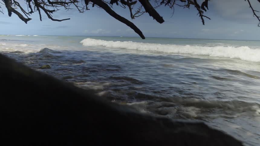 Waves rolling ashore on a rocky beach
