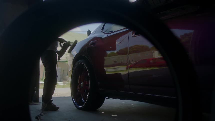 Man buffing a car