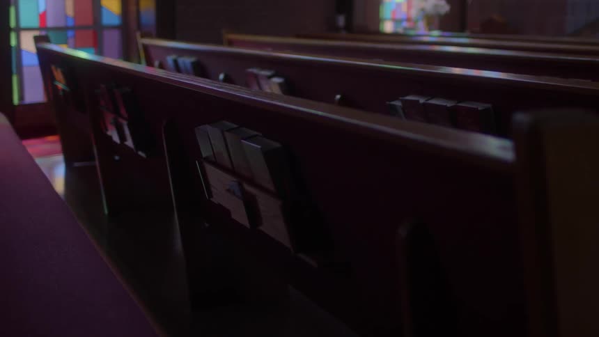 Church pews are shown in a chapel